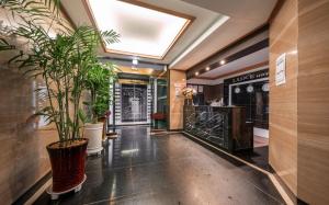 a hallway with potted plants in a store at Nowon Luxe in Seoul