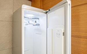 a white refrigerator with its door open in a room at Nowon Luxe in Seoul +39 photos
