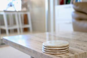 a stack of plates sitting on a counter top at Tranquillity On The Promenade in Batemans Bay +46 photos