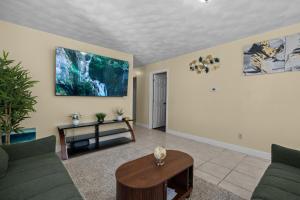 a living room with two couches and a table at The Public Street Residence in Providence