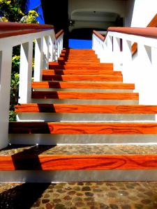 a set of stairs with wood and white railing at Oasis Resort and Spa in Boracay