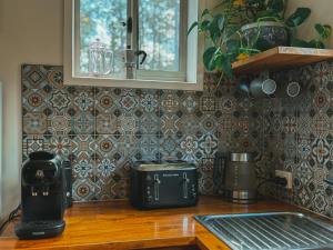 a kitchen counter with two appliances on a counter top at The Little Seed in Franklin