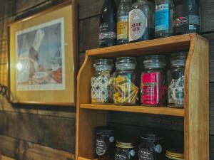 a wooden shelf with jars of food on it at The Little Seed in Franklin +26 photos