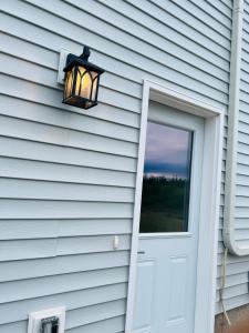a door and a window on a house at New & Modern Suite in Bristol Riverview in Riverview