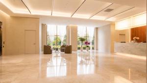 a lobby with a table in the middle of a room at Hotel Laon in Busan