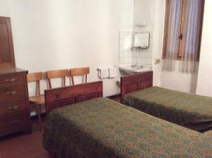 Voodi või voodid majutusasutuse Albergo Cervo toas