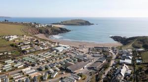 an aerial view of a beach with houses and the ocean at Challaborough caravan in Burgh Island