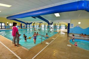 a group of children playing in a swimming pool at Challaborough caravan in Burgh Island