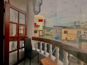a balcony with a view of a city at Vista Inn Patong in Patong Beach