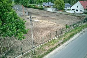 an aerial view of a dirt field next to a street at Gortatowo Natura 2000 in Gortatowo