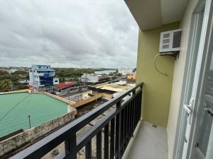 a balcony with a view of a city at D Avenue Studio in Iloilo City