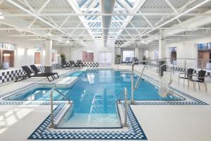 a large pool with blue water in a building at Delta Hotels by Marriott Halifax Downtown in Halifax