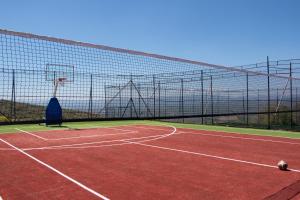 a tennis court with a net on top of it at Loft Orman Tatil Köyü in Ankara +24 photos