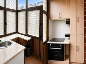 a small kitchen with a sink and a stove at Ars Rooms in Prizren