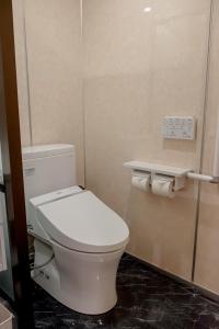 a bathroom with a white toilet in a stall at Nature Resort in Kawamoto in Kawamoto +10 photos