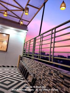 a view from the balcony of a building at Fng Guest House in Noida +12 photos