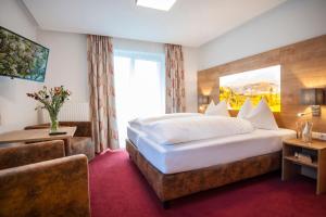 Ein Bett oder Betten in einem Zimmer der Unterkunft Landhaus & Appartementhaus Haussteiner