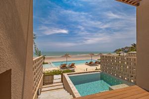 a view of the beach from the balcony of a hotel at Riva Hua Hin in Ban Khao Takiap