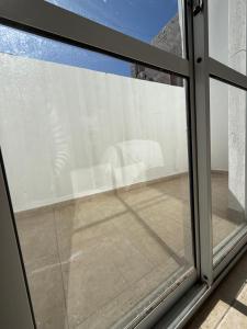 a sliding glass window with a view of a patio at Nova IVE Apart in San Luis