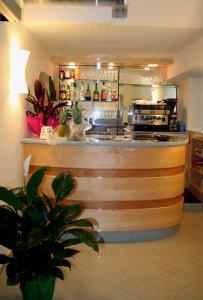 a kitchen with a counter with a counter top at Grazia Hotel in Sperlonga