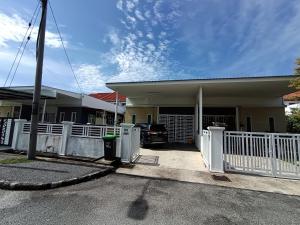 a house with a white fence in front of it at Lynn Homestay Alor Setar in Alor Setar