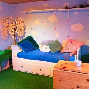 a bedroom with a bed with blue sheets and clouds at Emporium in Lobbes +18 photos