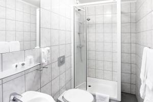 Koupelna v ubytování Fosshotel Baron