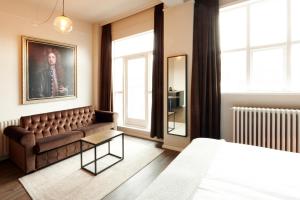 Postel nebo postele na pokoji v ubytování Fosshotel Baron