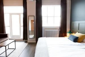 Postel nebo postele na pokoji v ubytování Fosshotel Baron