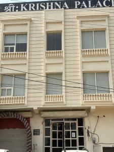 a building with a sign on the front of it at Shree Krishna Palace Hotel - Couple Friendly in Lucknow