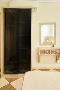 a bedroom with a mirror and a bed and a sink at Pyramids Stars Egypt in Cairo +54 photos