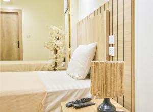 a bedroom with a bed and a table with a lamp at Pyramids Stars Egypt in Cairo