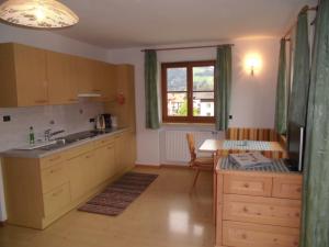 Kuchyň nebo kuchyňský kout v ubytování Appartements Färberhof