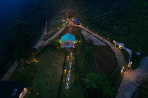 an aerial view of a house with lights around it at Casa de Monique Glamping Resort in Bogor
