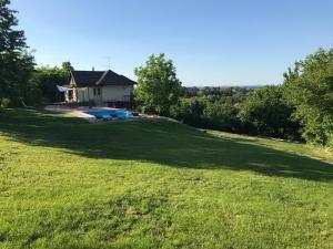 a large yard with a house and a pool at Villa Mila in Ludbreg