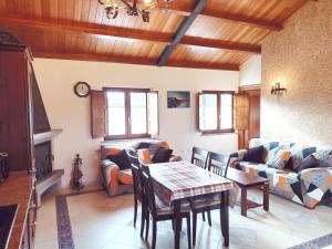 a living room with a table and a couch at Apartamentos Navalin in Tapia de Casariego