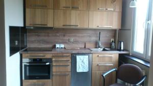 Kuchyň nebo kuchyňský kout v ubytování Apartment 6 Gwiazdek