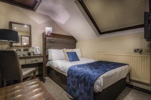Katil atau katil-katil dalam bilik di The Old Bridge Inn, Holmfirth, West Yorkshire