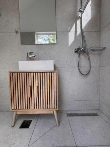 a bathroom with a sink and a shower at Casa Regina - 5min to Beach - Peaceful Retreat in Lithakia +35 photos