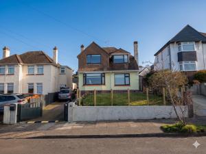 a house with a fence in front of it at 15 Aller Park Rd, Newton Abbot in Newton Abbot