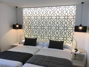 Posteľ alebo postele v izbe v ubytovaní Hotel Comfort Dauro 2