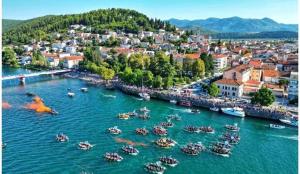 a group of boats in the water in a harbor at Aurelia Residence in Metković