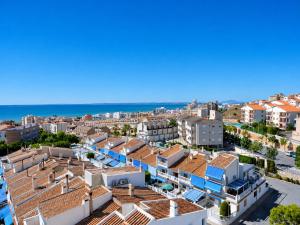 an aerial view of a city with houses and the ocean at Penthouse with Panoramic View Santa Pola in Santa Pola