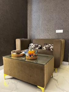 a couch with two baskets on top of a coffee table at Moon Escape Studio in Ghaziabad