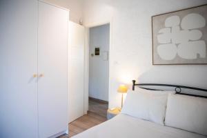 a bedroom with a bed and a door to a hallway at Villa NS in Perdika +15 photos