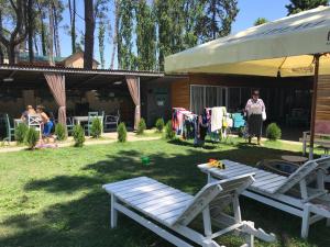 a woman standing in a yard next to a house at Femyli rooms in Shekhvetili +48 photos