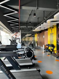 a gym with rows of treadmills and exercise bikes at Moon Escape Studio in Ghaziabad