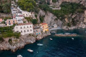 a group of boats in a body of water at Il Sogno Costa d'Amalfi in Conca dei Marini