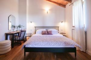 a bedroom with a large bed and a desk at casa PRIANI in Krasica +29 photos