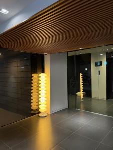 a lobby with yellow lights in a building at The hotel 1997 - 더호텔 1997 in Seoul